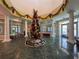 Beautiful lobby with holiday decorations, marble floors, and elegant pillars provides a welcoming and festive atmosphere at 9519 Green Needle Dr, New Port Richey, FL 34655