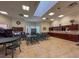 Functional multipurpose room with tables, chairs, and kitchen area, providing a flexible space for activities and gatherings at 9519 Green Needle Dr, New Port Richey, FL 34655