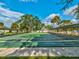 Enjoy the shuffleboard courts in a community surrounded by lush landscaping and beautiful blue skies at 11532 Holly Ann Dr, New Port Richey, FL 34654