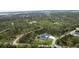 Striking aerial shot of the property with views of a contemporary home on a spacious lot at 12149 Chapman Ave, Port Charlotte, FL 33953