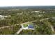Overhead view of the property, highlighting its well-maintained grounds and peaceful, wooded setting at 12149 Chapman Ave, Port Charlotte, FL 33953