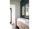 Contemporary bathroom with stylish dual sinks, modern fixtures, and colorful backsplash at 12149 Chapman Ave, Port Charlotte, FL 33953