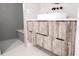 Contemporary bathroom featuring a floating vanity with a vessel sink and modern fixtures at 12149 Chapman Ave, Port Charlotte, FL 33953