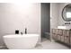 Elegant bathroom features a freestanding tub and stylish vanity with modern fixtures at 12149 Chapman Ave, Port Charlotte, FL 33953