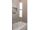 Modern bathroom with a glass-enclosed shower and built-in shelving for toiletries at 12149 Chapman Ave, Port Charlotte, FL 33953