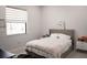 Well-lit bedroom offering a serene retreat with a comfortable bed and bright window at 12149 Chapman Ave, Port Charlotte, FL 33953