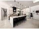 Spacious kitchen with a large island, pendant lighting, modern appliances and custom cabinetry at 12149 Chapman Ave, Port Charlotte, FL 33953