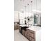 Kitchen features a large island with a farmhouse sink and sleek cabinets at 12149 Chapman Ave, Port Charlotte, FL 33953