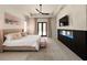 Serene main bedroom features a modern fireplace, neutral tones, and access to the outdoor area at 12149 Chapman Ave, Port Charlotte, FL 33953