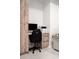 Home office with wood built-ins, a work desk, and a comfortable work chair at 12149 Chapman Ave, Port Charlotte, FL 33953