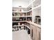 Well-organized pantry with custom shelving and cabinets, providing ample storage space at 12149 Chapman Ave, Port Charlotte, FL 33953