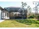 Patio area offering a secluded space for relaxation, adjacent to a lush green lawn at 12149 Chapman Ave, Port Charlotte, FL 33953