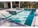 Backyard pool and spa area featuring a clear view of the wooded property at 12149 Chapman Ave, Port Charlotte, FL 33953
