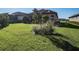 Beautiful backyard with lush green lawn and landscaping, ideal for outdoor activities and relaxation at 3312 Francoa Dr, Odessa, FL 33556