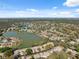 Expansive aerial shot of a residential area dotted with lakes and lush greenery at 7414 Heather Walk Dr, Weeki Wachee, FL 34613