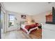 Cozy bedroom featuring wood floors and a sliding glass door at 7414 Heather Walk Dr, Weeki Wachee, FL 34613