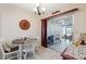 Bright dining area featuring tile floors and a sliding glass door to the outdoor space at 7414 Heather Walk Dr, Weeki Wachee, FL 34613