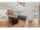 Comfortable living room with wood floors, plush sofas, and bright views at 7414 Heather Walk Dr, Weeki Wachee, FL 34613