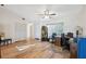 A sunlit office space with wood floors, a ceiling fan, and a large closet at 7414 Heather Walk Dr, Weeki Wachee, FL 34613