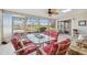 Enclosed outdoor patio with a ceiling fan and a lake view at 7414 Heather Walk Dr, Weeki Wachee, FL 34613