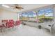 Enclosed outdoor patio with lake views and natural light at 7414 Heather Walk Dr, Weeki Wachee, FL 34613