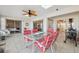 Enclosed outdoor patio with a ceiling fan and access to multiple rooms in the home at 7414 Heather Walk Dr, Weeki Wachee, FL 34613