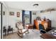 Charming bedroom featuring a rocking chair, wood furniture, and natural light from the window at 7815 Tanglewood Dr, New Port Richey, FL 34654