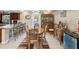 Open-concept dining area with access to the kitchen, adjacent to an ornate china cabinet at 7815 Tanglewood Dr, New Port Richey, FL 34654
