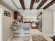 Kitchen breakfast bar with dark wood cabinets and stainless steel appliances at 7815 Tanglewood Dr, New Port Richey, FL 34654