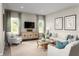 Bright living room with stylish decor, large windows, comfortable seating, and mounted television at 10008 Zennia Ln, Parrish, FL 34219
