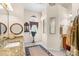 Bathroom with double vanity, granite counters, decorative mirrors and accent window at 10124 Southern Breeze Ct, Weeki Wachee, FL 34613