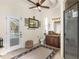 A spacious bathroom with double sink vanity, a walk-in shower, and access to the pool area at 10124 Southern Breeze Ct, Weeki Wachee, FL 34613