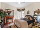 Inviting bedroom with a cozy fireplace and a view of the outside at 10124 Southern Breeze Ct, Weeki Wachee, FL 34613