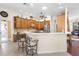 Bright kitchen features wooden cabinets, white counters, a breakfast bar and stainless appliances at 10124 Southern Breeze Ct, Weeki Wachee, FL 34613