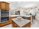 Spacious kitchen showcases wood cabinetry, stainless steel appliances, and stone countertops at 10124 Southern Breeze Ct, Weeki Wachee, FL 34613