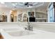 Bright kitchen sink with sleek faucet and white countertop, complemented by elegant built-in shelving in the background at 10124 Southern Breeze Ct, Weeki Wachee, FL 34613
