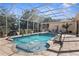 Inviting screened pool with pavers and a decorative fountain at 10124 Southern Breeze Ct, Weeki Wachee, FL 34613