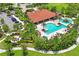 Aerial view of a community pool with a sundeck and landscaped surroundings at 11204 Egeria Dr, Odessa, FL 33556