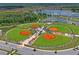 Aerial view of baseball fields with well-maintained green grass and ample parking at 11204 Egeria Dr, Odessa, FL 33556