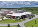 Aerial view of the modern school building with a landscaped lawn and ample parking at 11204 Egeria Dr, Odessa, FL 33556