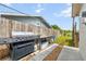 Outdoor grill area features a modern stainless steel grill and a outdoor food preparation area at 6920 Medlar Dr, New Port Richey, FL 34653