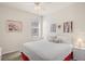 Bright bedroom featuring a ceiling fan, window and soft decor at 11243 Merganser Way, New Port Richey, FL 34654