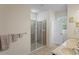 Elegant bathroom featuring dual sinks, a glass-enclosed shower, and a private toilet area at 11243 Merganser Way, New Port Richey, FL 34654