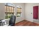 Office with hardwood floors, natural light and views of the outdoors through large windows at 11243 Merganser Way, New Port Richey, FL 34654