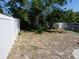 Fenced backyard area offers ample space and a secure dog kennel at 4011 W Mango Ave, Tampa, FL 33616