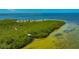 High-angle view of the park's lush tree covering and boardwalk against the ocean at 5742 Meadowlane St, New Port Richey, FL 34652
