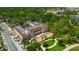 Aerial view of a historic building with well-manicured landscaping and nearby parks at 5742 Meadowlane St, New Port Richey, FL 34652