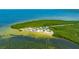 Scenic aerial view showcasing the park's beach, picnic area, lush trees, and ocean waters at 5742 Meadowlane St, New Port Richey, FL 34652