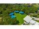 Aerial view of a beautifully landscaped park featuring modern shelters and ample green space for recreation at 5742 Meadowlane St, New Port Richey, FL 34652
