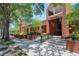 Grand entrance to a classic building with brick facade and manicured landscaping at 5742 Meadowlane St, New Port Richey, FL 34652